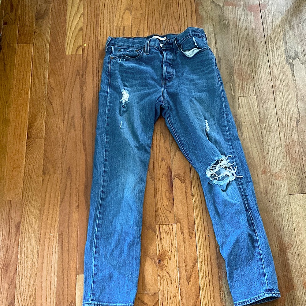Levi riped blue jeans